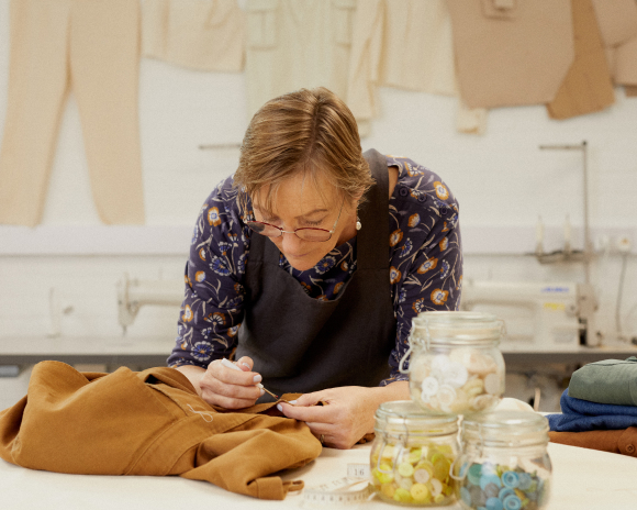 Seamstress mending a seam
