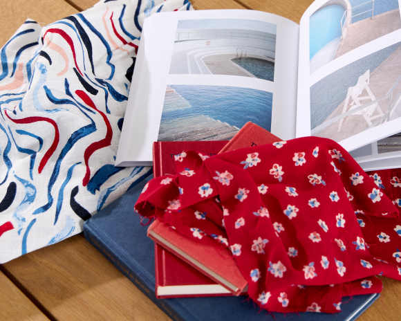 stack of books surrounded by Sesalt printed fabric